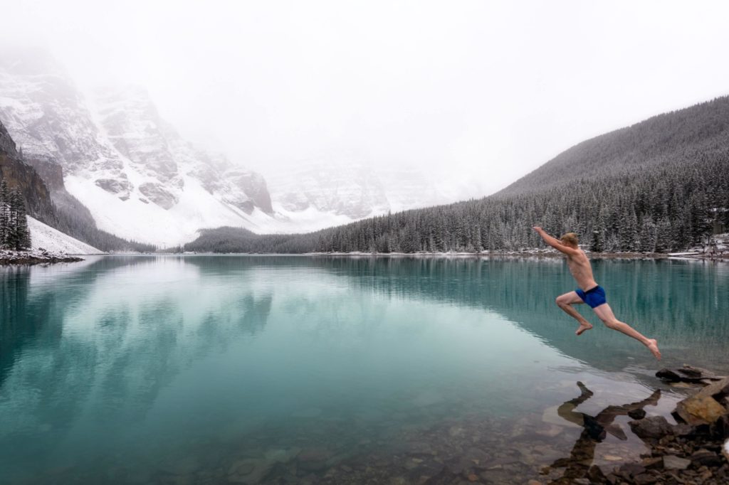 Shirtless Man Jumping into Cold Water
