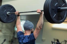 Man Weightlifting at a Gym