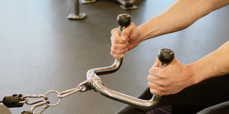 Man Lifting Weights at Gym