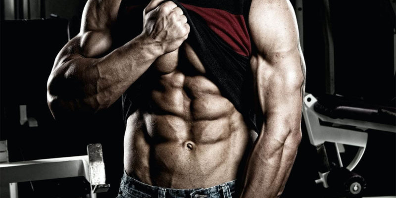 Man Lifting up Shirt To Show Abs and Pump