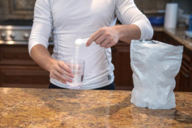Man Pouring Beta-Alanine into a Cup