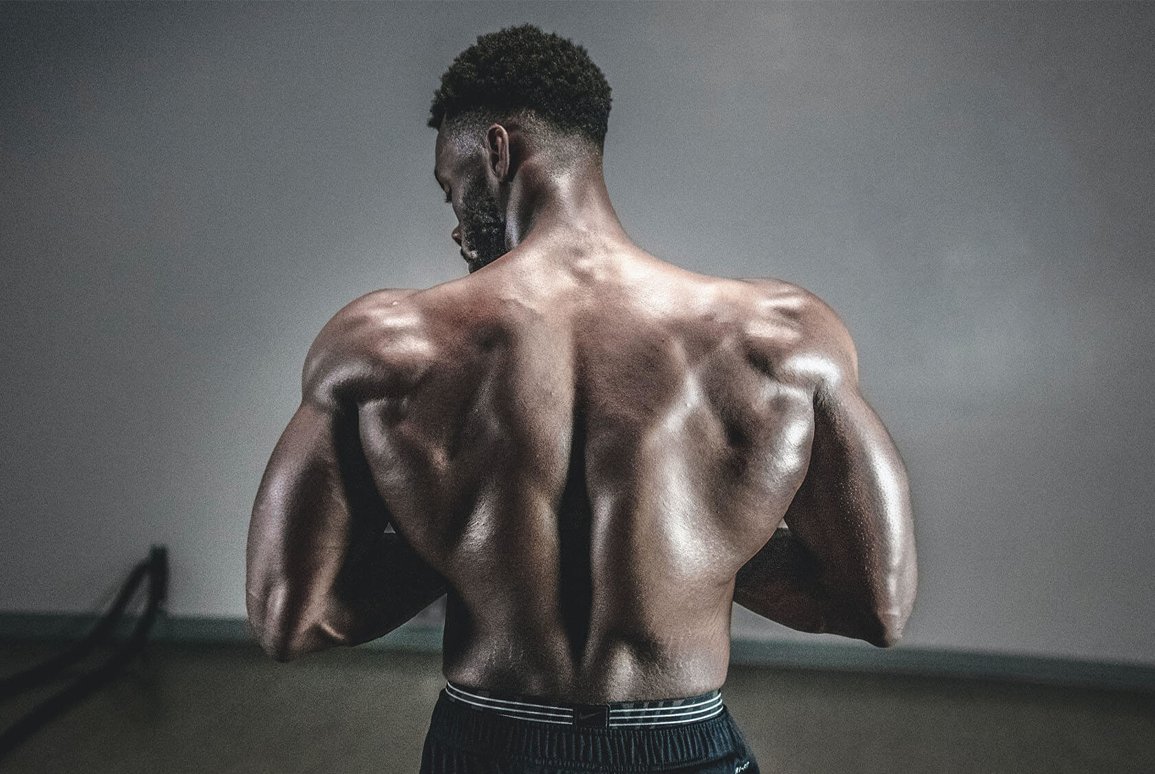 Bodybuilder Flexing Back Muscles