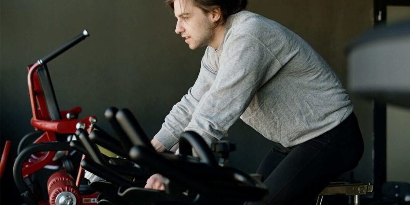Man on Exercise Bike Doing Cardio