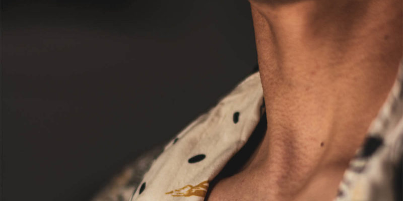 Close Up Photo of Man's Neck