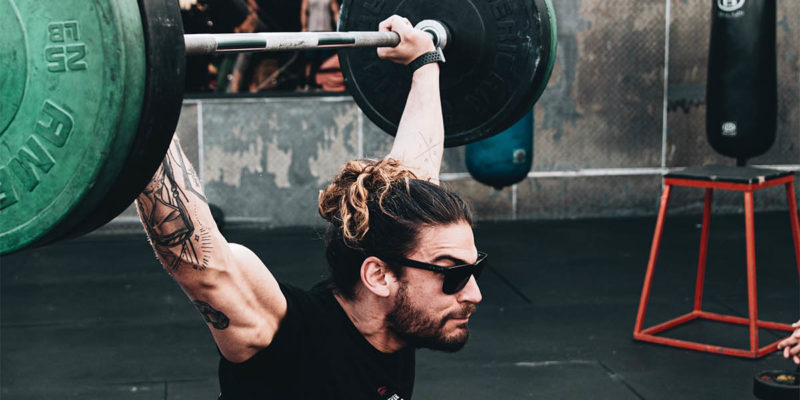 Man Weightlifting with Sunglasses on
